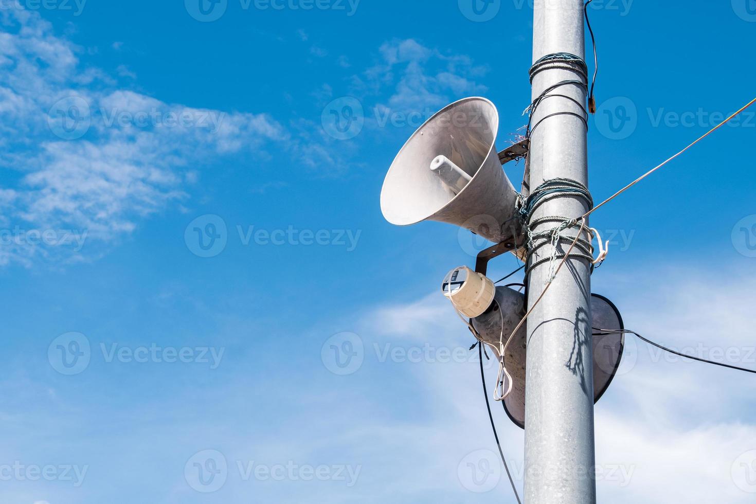 Double megaphone on the metal pole with copy space. photo