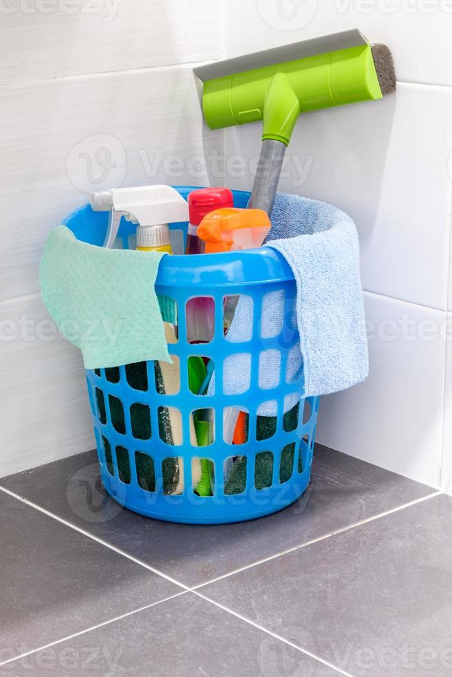 Group of the cleaning set in the plastic basket. photo