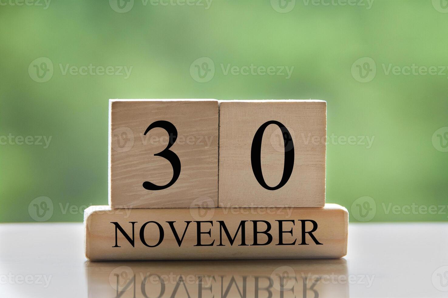 November 30 calendar date text on wooden blocks with copy space for ideas or text. Copy space photo