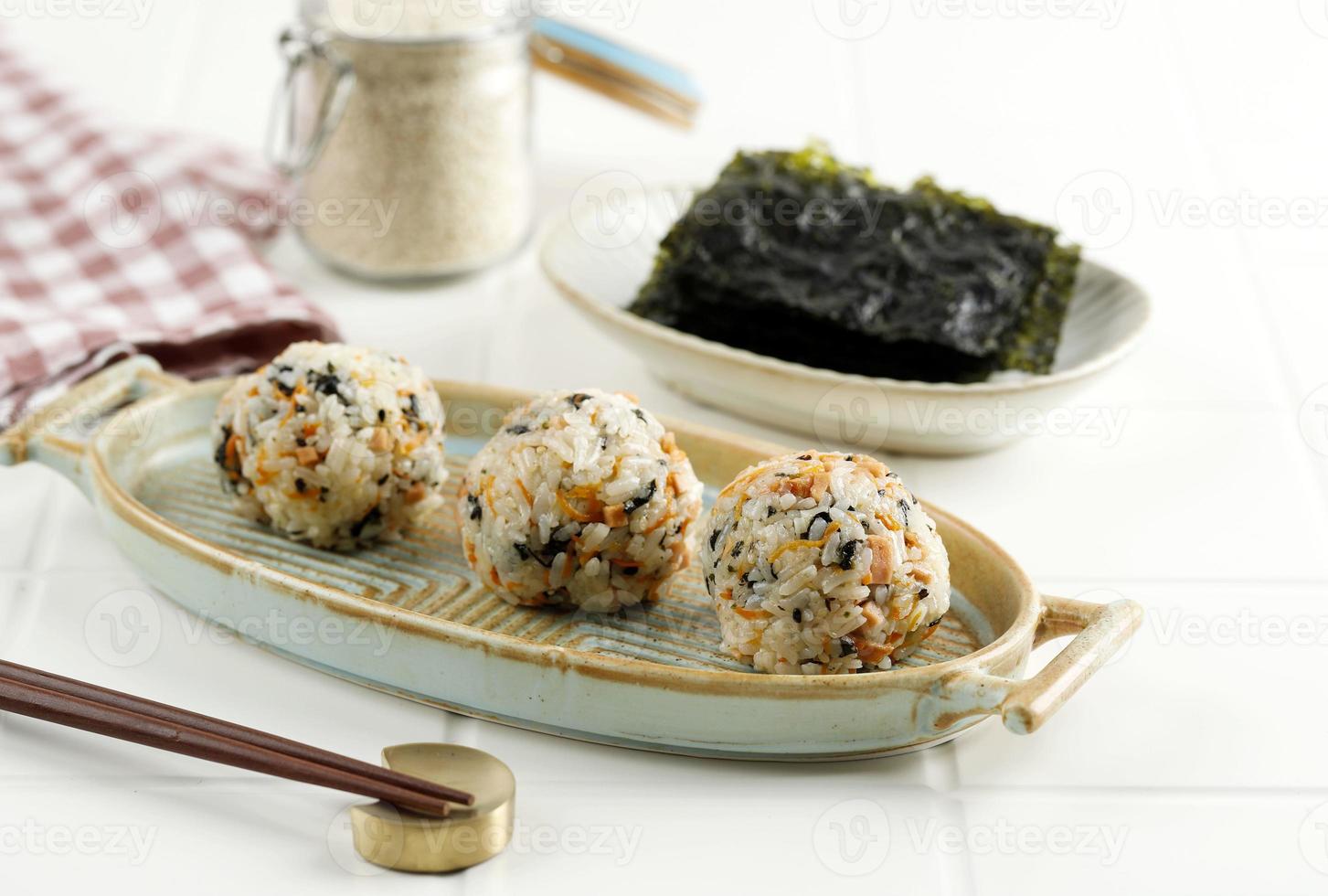 Korean Seaweed Rice Balls or Jumeokbap with Ham, Sausage, Sesame Seed, Sesame Oil, and Stir Fry Carrots. photo