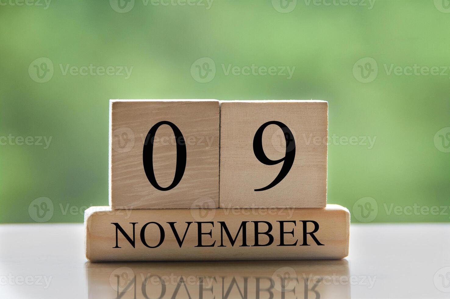 November 9 calendar date text on wooden blocks with copy space for ideas or text. Copy space photo