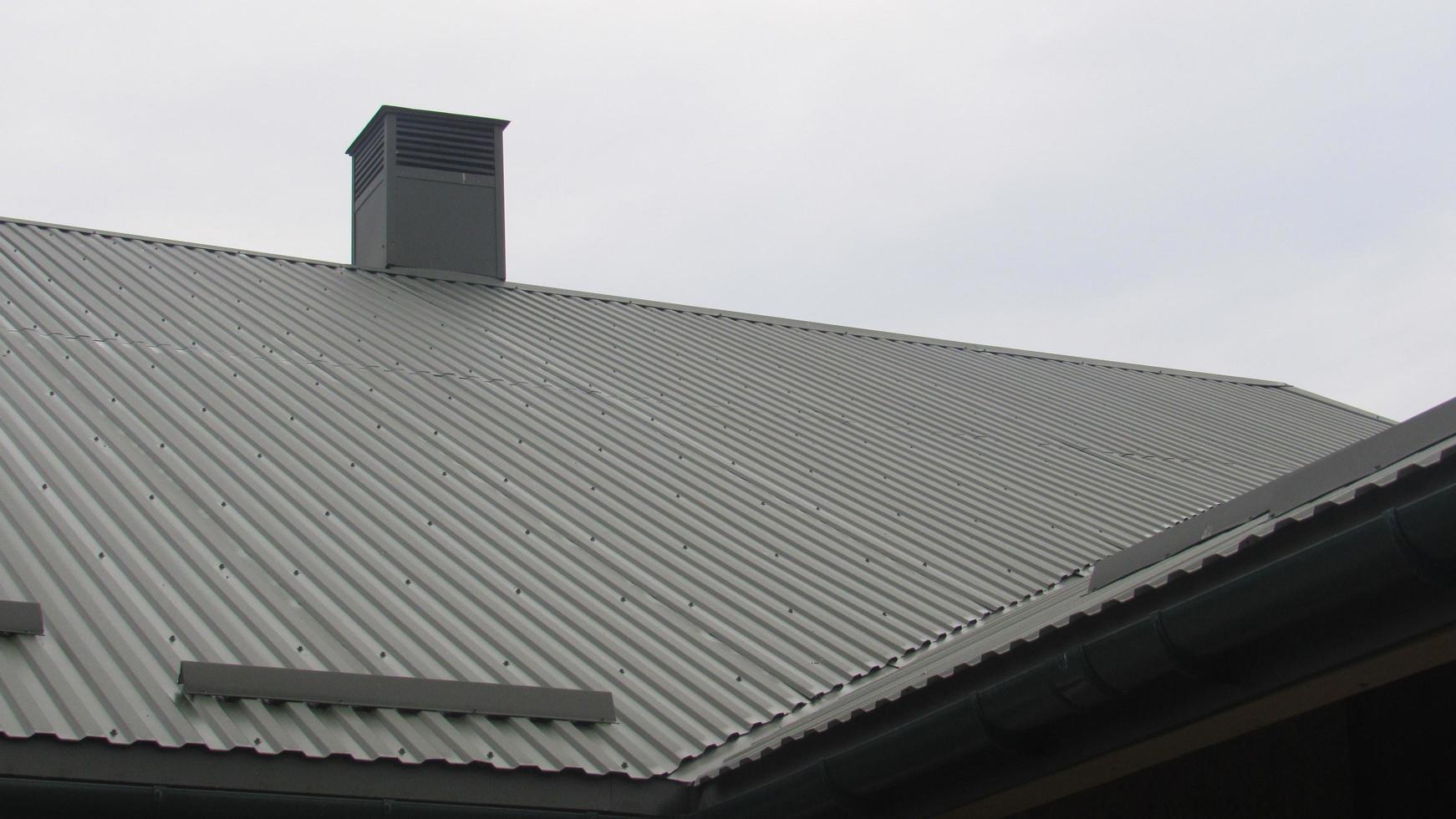 metal profile. roofing. replacement of coating for the house. roof repair photo