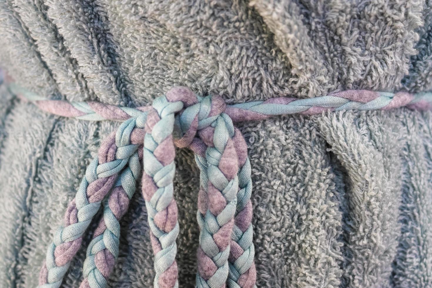 Detailed close up view on samples of cloth and fabrics in different colors found at a fabrics market photo