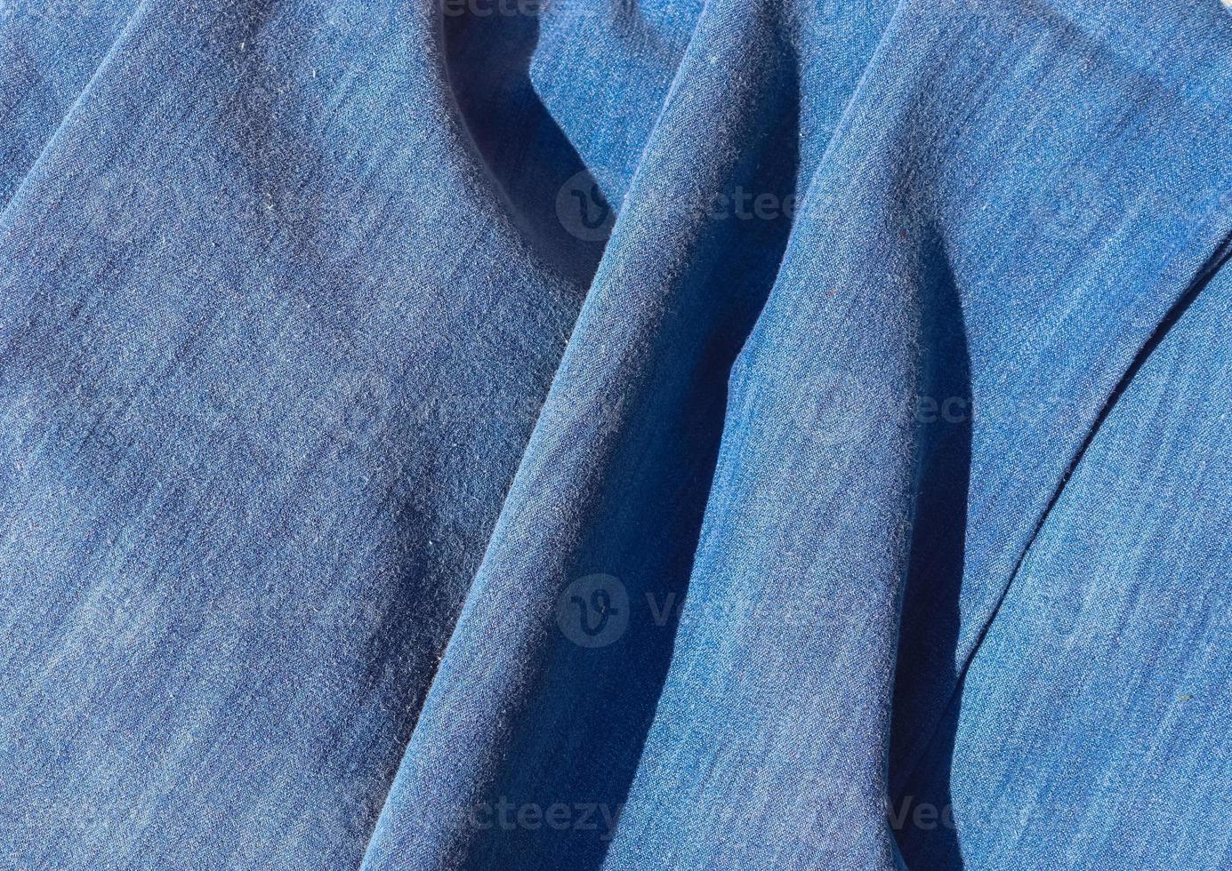Detailed close up view on samples of cloth and fabrics in different colors found at a fabrics market photo
