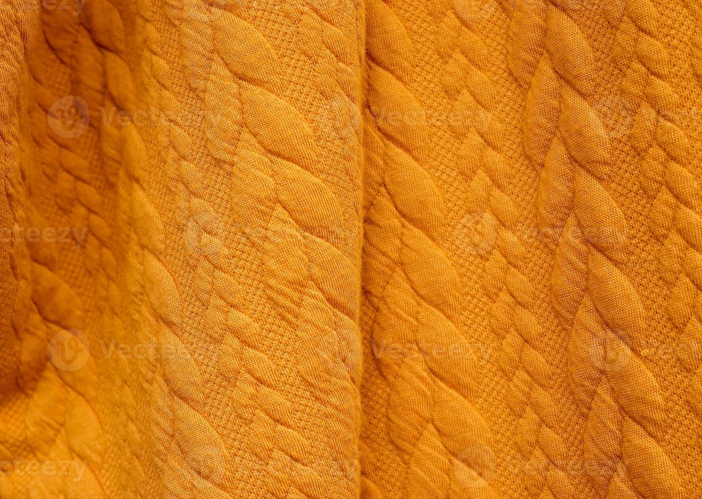 Detailed close up view on samples of cloth and fabrics in different colors found at a fabrics market photo
