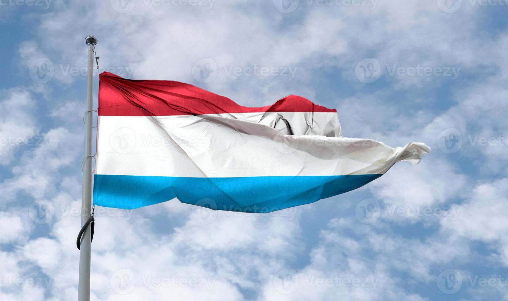 Luxembourg flag - realistic waving fabric flag. photo