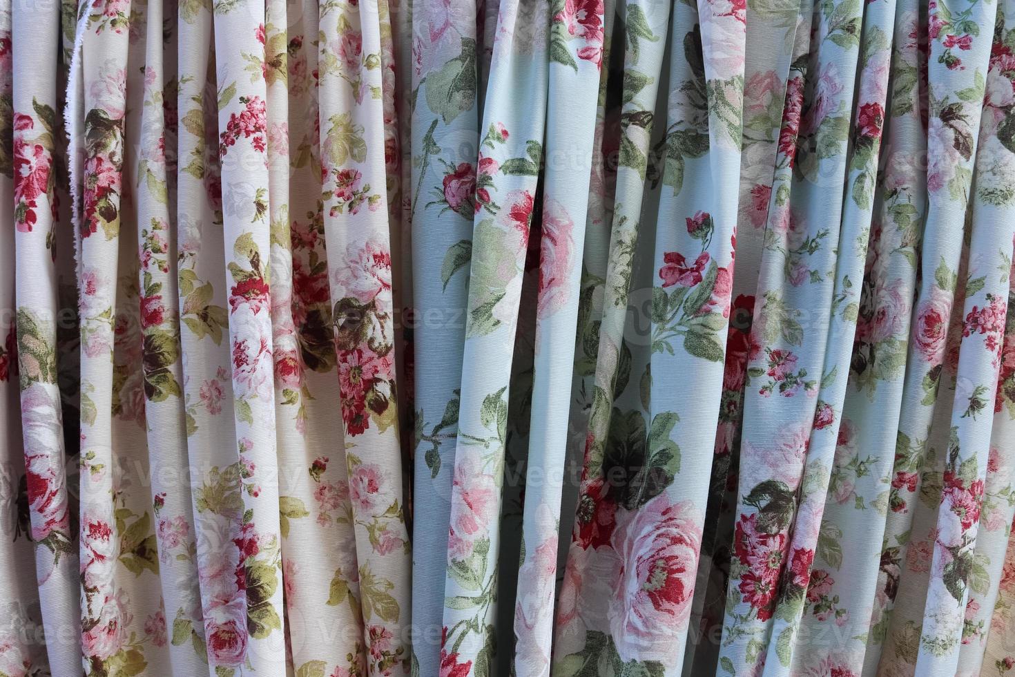 Detailed close up view on samples of cloth and fabrics in different colors found at a fabrics market photo