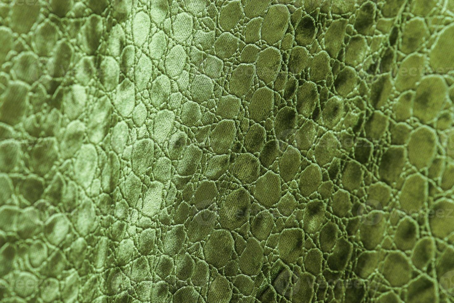 Detailed close up view on samples of cloth and fabrics in different colors found at a fabrics market photo