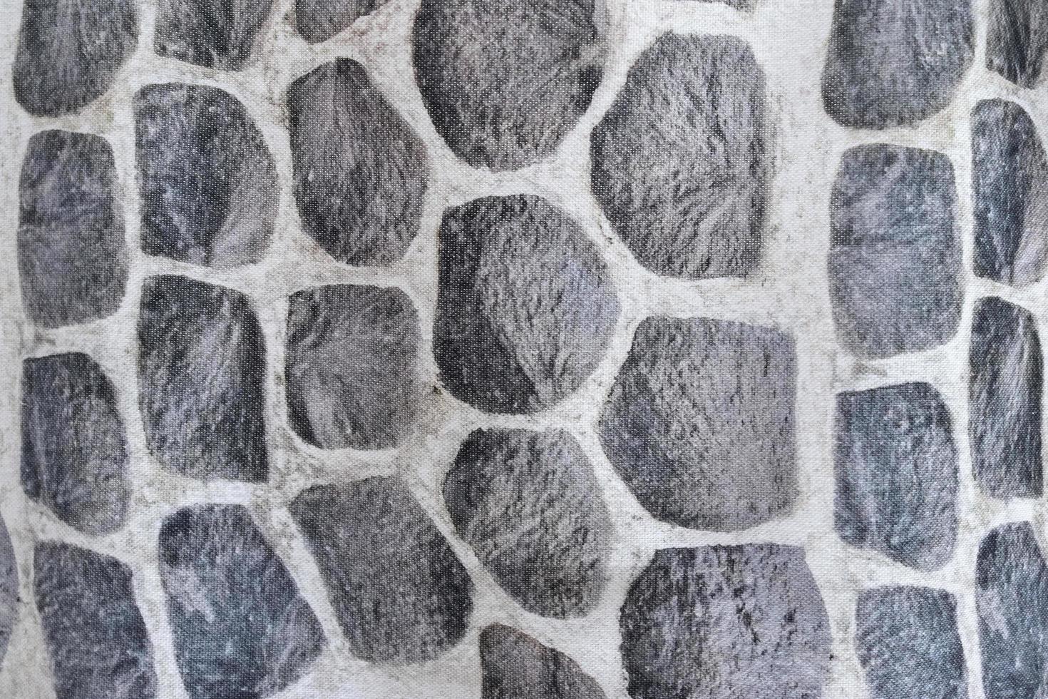 Detailed close up view on samples of cloth and fabrics in different colors found at a fabrics market photo
