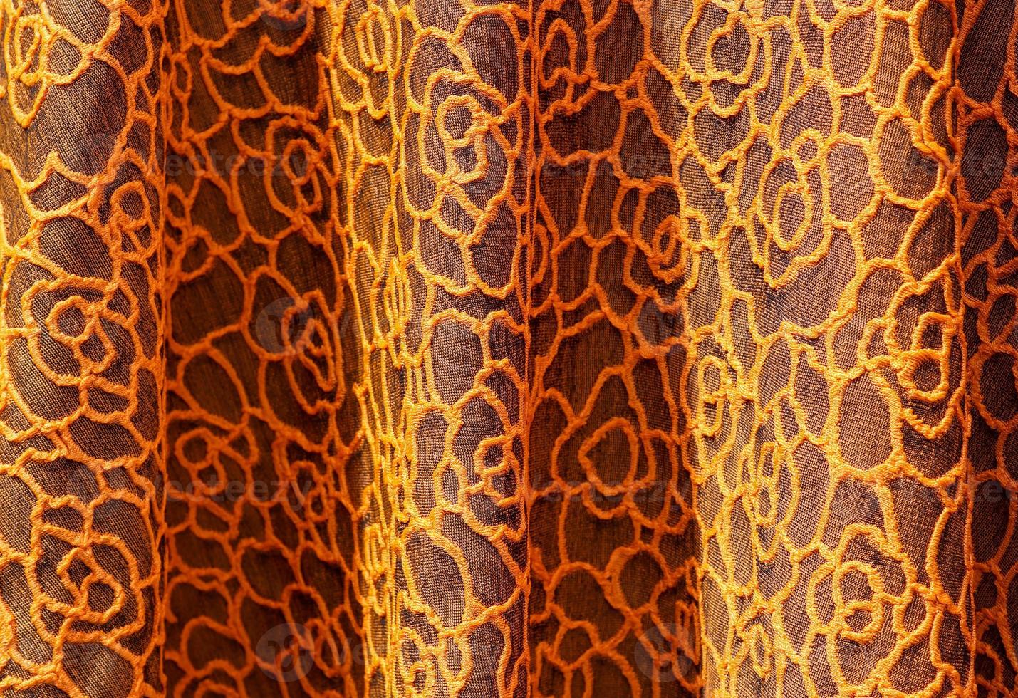 Detailed close up view on samples of cloth and fabrics in different colors found at a fabrics market photo