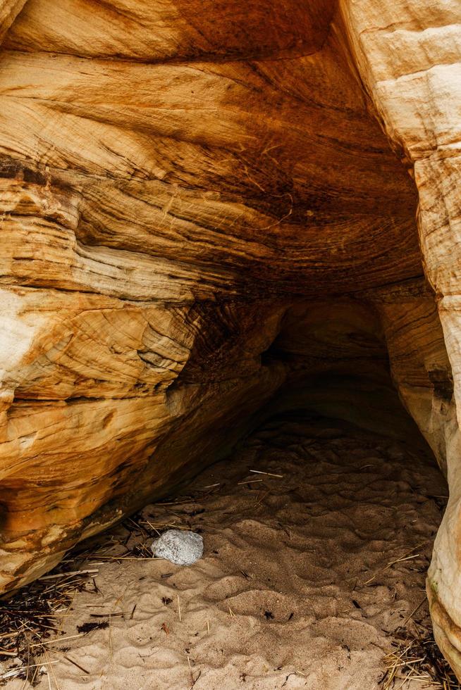 Sand cliffs and cave photo