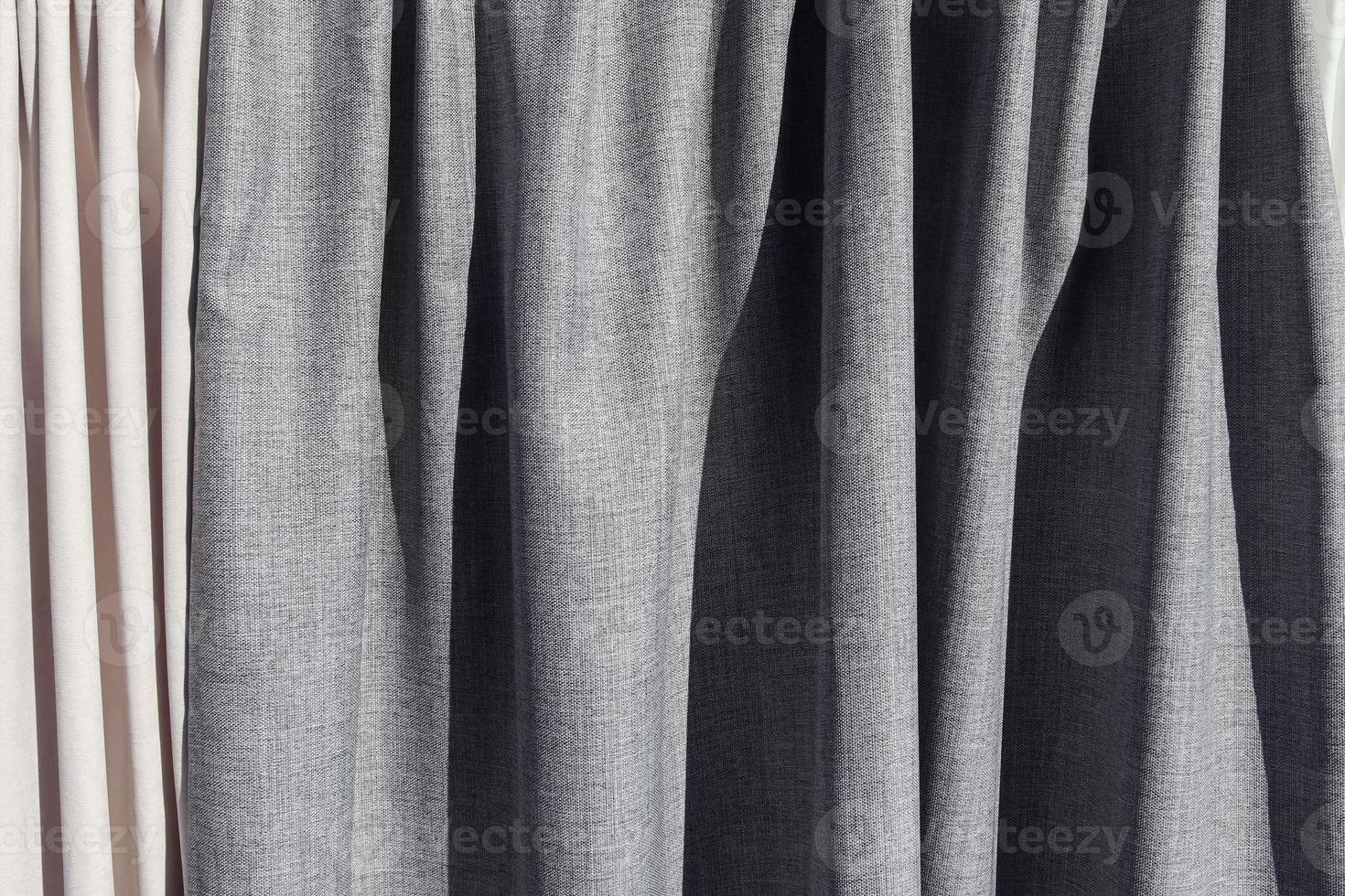 Detailed close up view on samples of cloth and fabrics in different colors found at a fabrics market photo