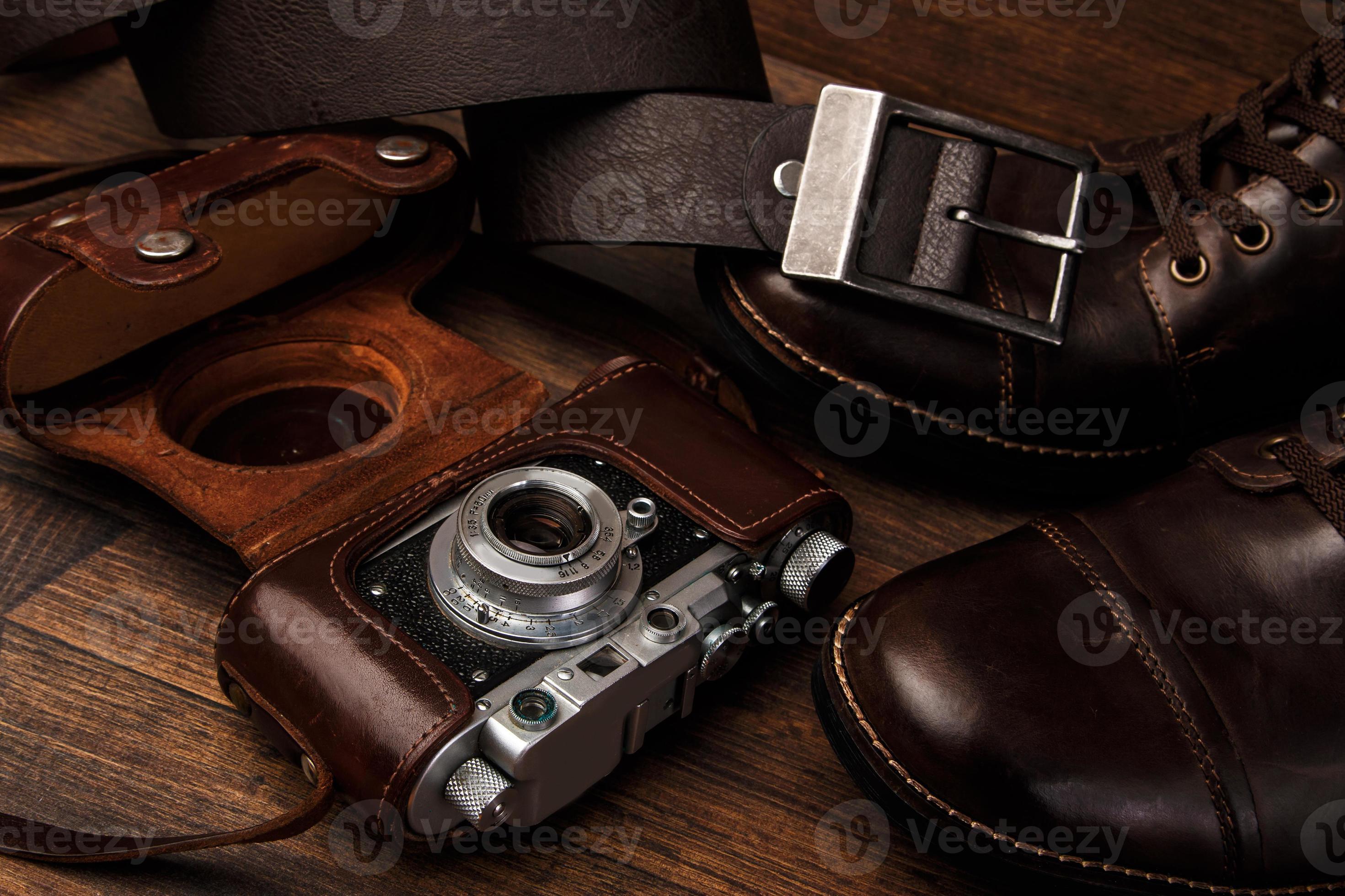 Boots and camera 9399886 Stock Photo at Vecteezy