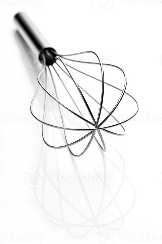 Stainless steel egg beater or egg whisk photo