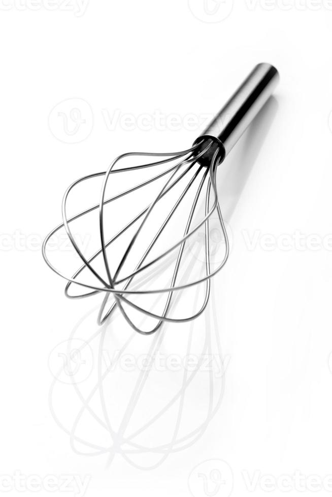 Stainless steel egg beater or egg whisk photo