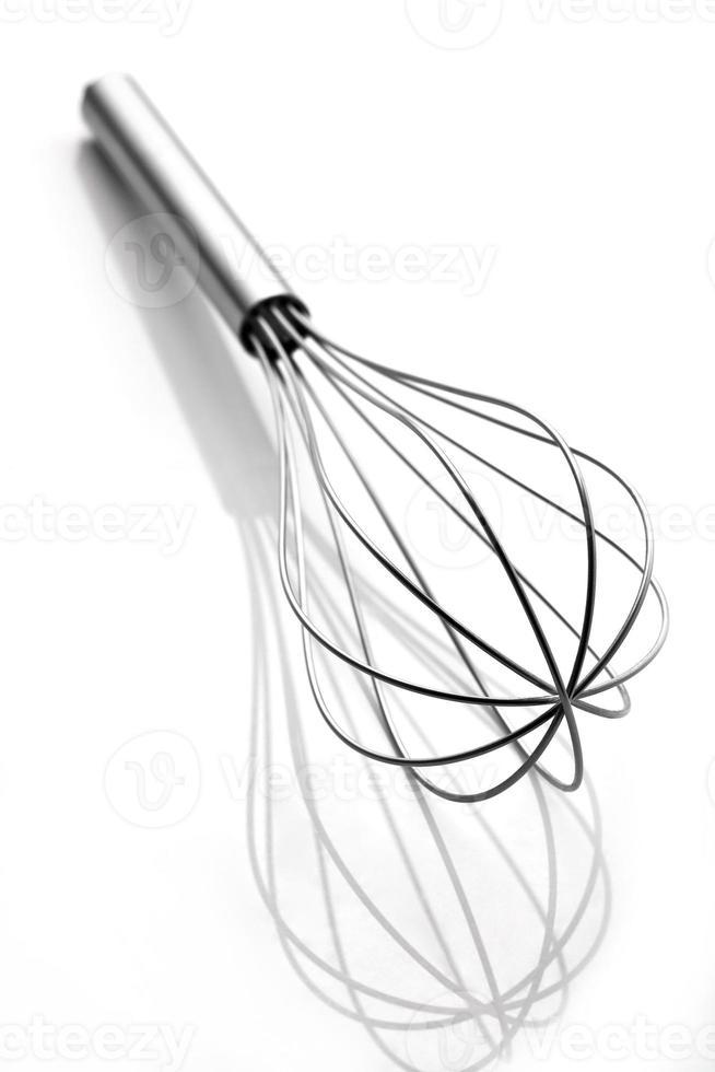 Stainless steel egg beater or egg whisk photo