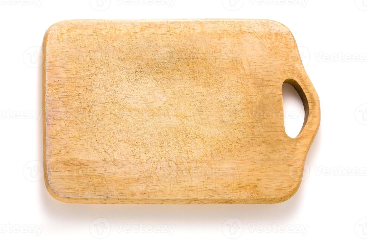 Wooden cutting board isolated on white photo