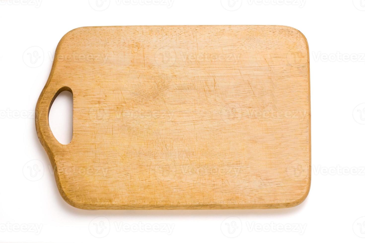 Wooden cutting board isolated on white photo