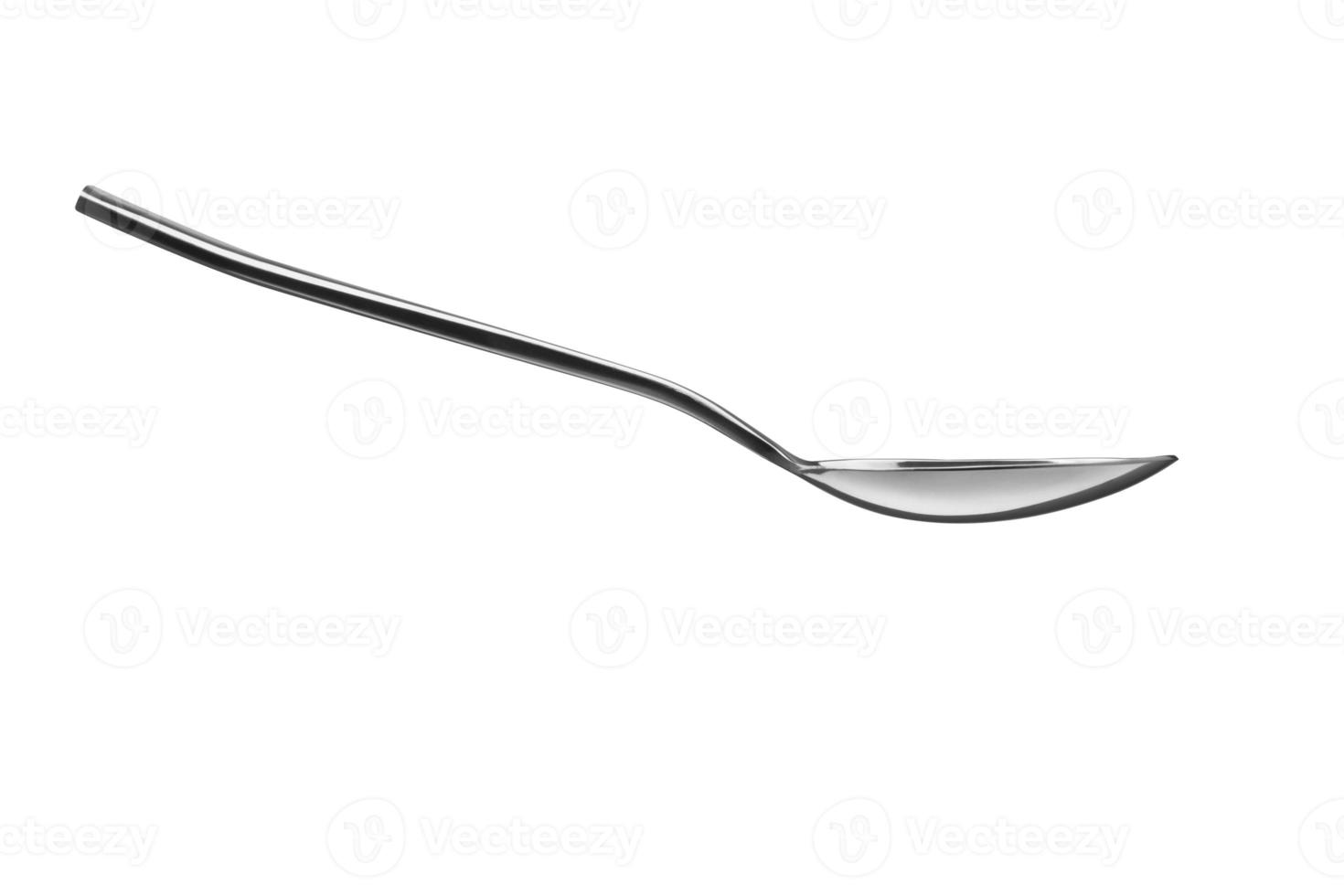 The metal shiny spoon isolated on white photo