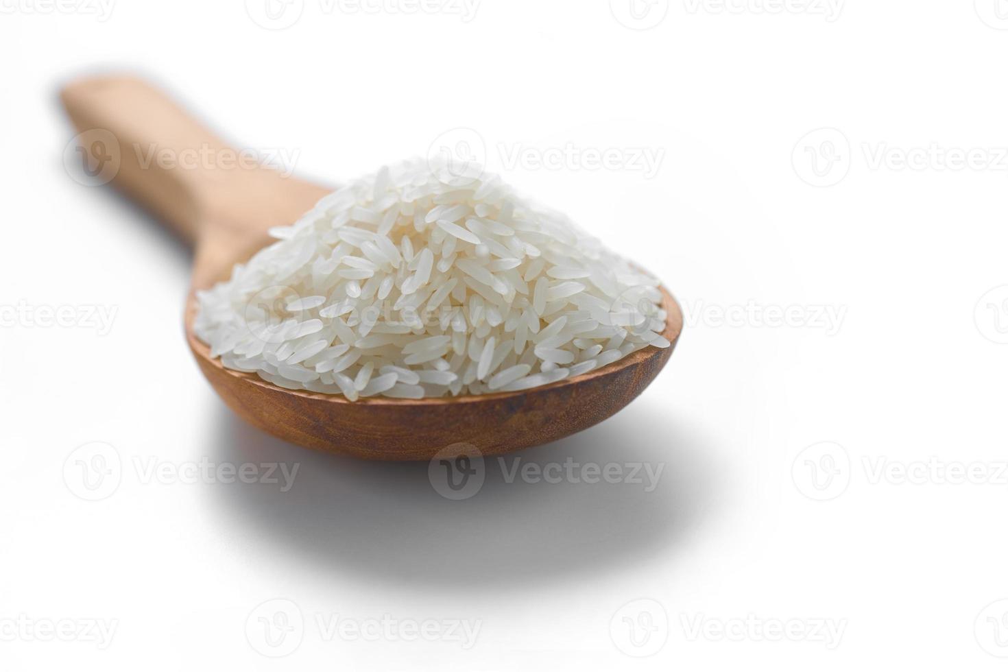White jasmine rice in the wood spoon photo