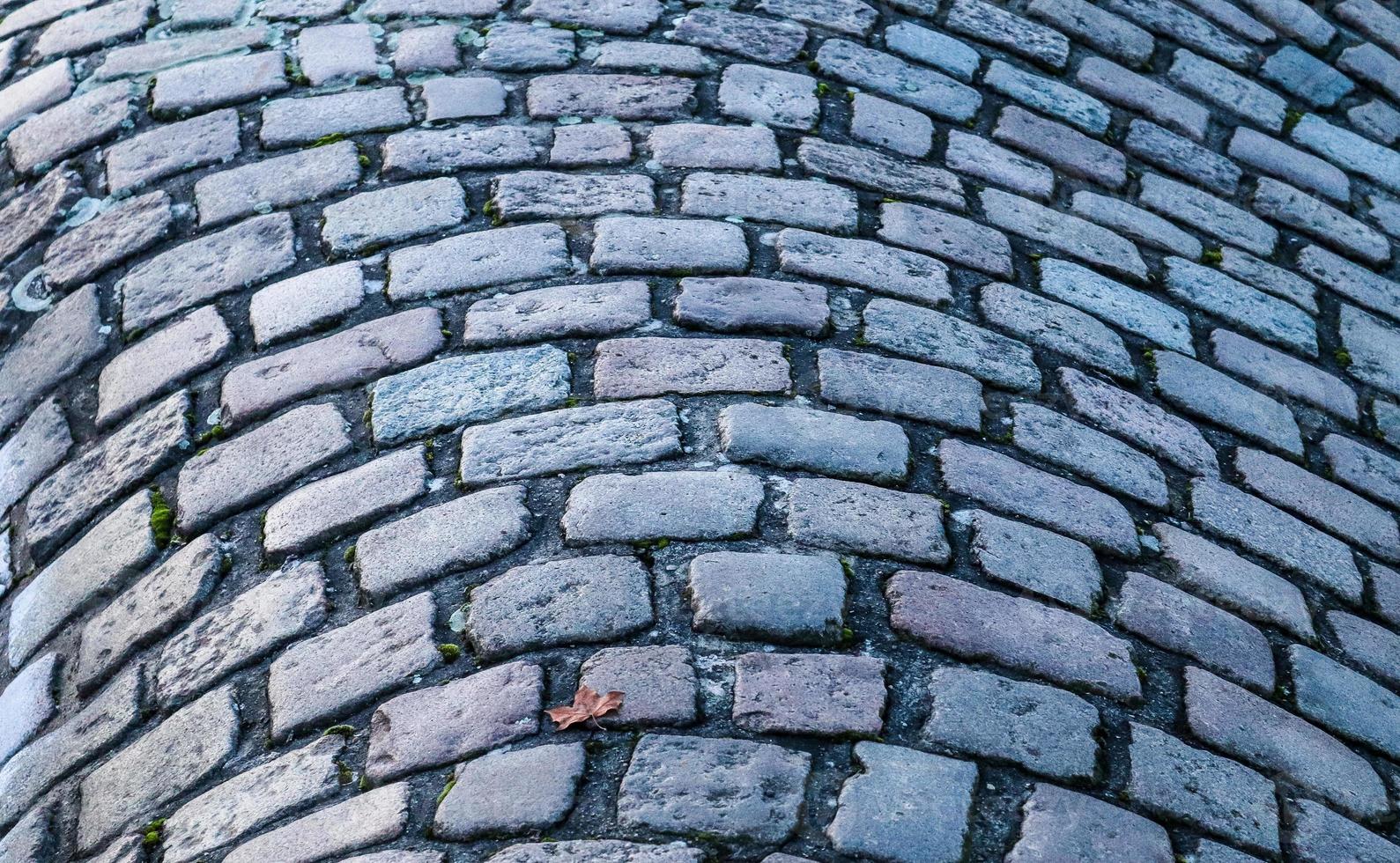 Detailed close up on old historical cobblestone roads and walkways photo