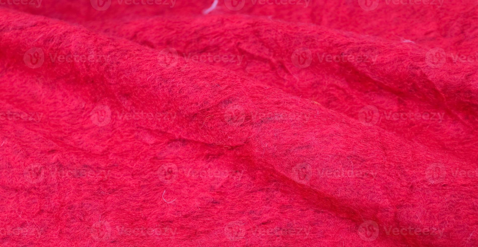 Close up view on samples of cloth and fabrics in different colors found at a fabrics market photo