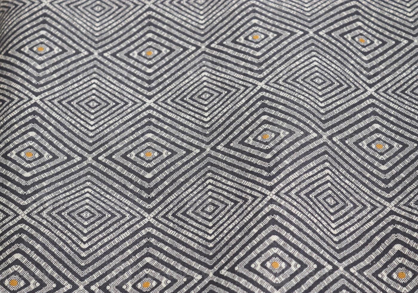 Detailed close up view on samples of cloth and fabrics in different colors found at a fabrics market photo