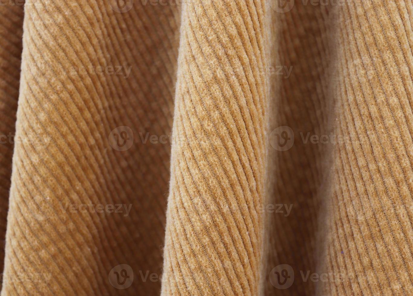 Detailed close up view on samples of cloth and fabrics in different colors found at a fabrics market photo
