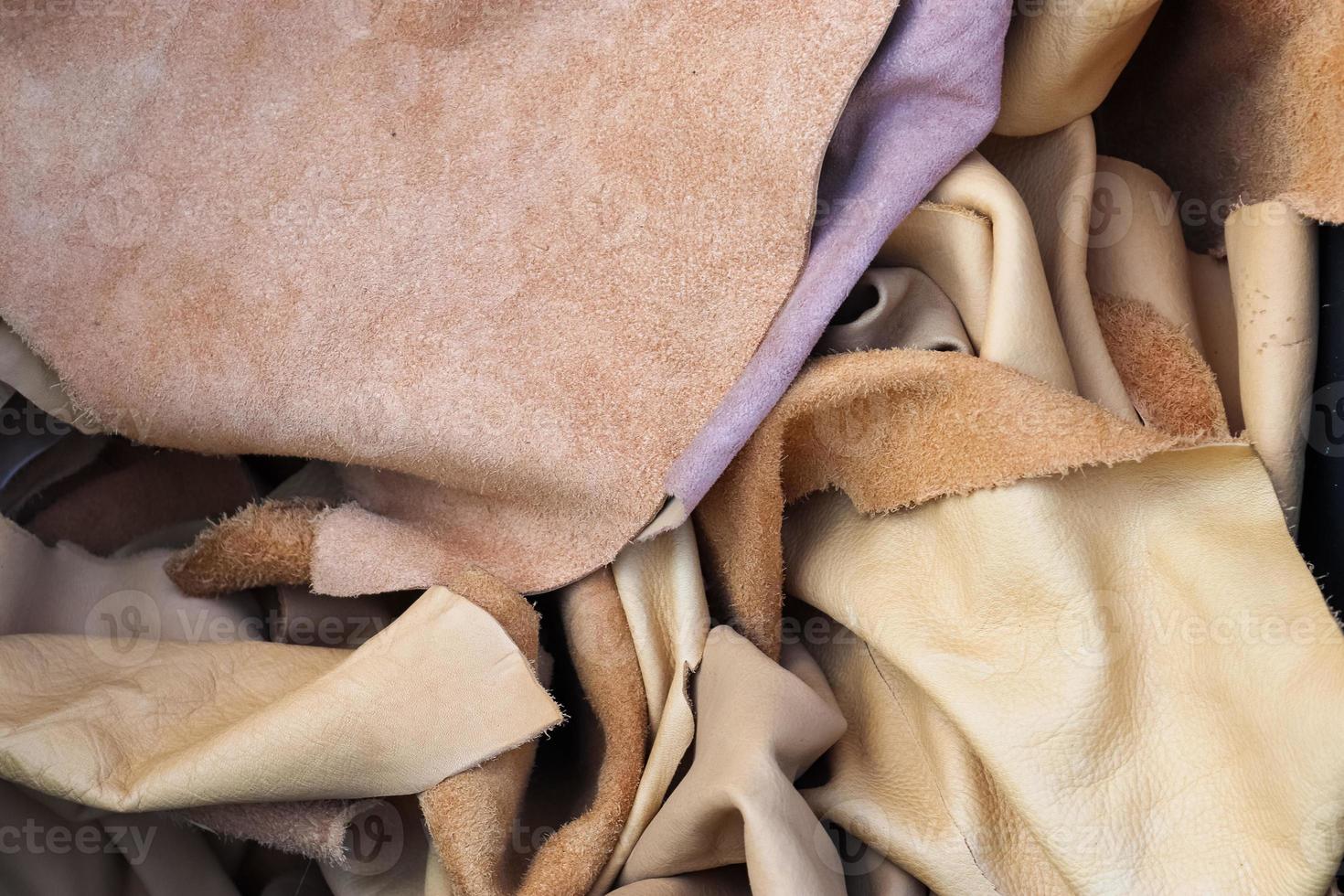 Detailed close up view on samples of cloth and fabrics in different colors found at a fabrics market photo