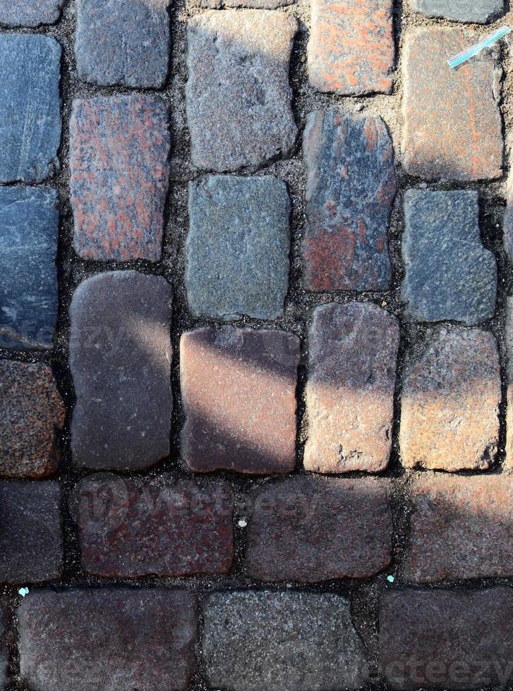 Detailed close up on old historical cobblestone roads and walkways photo