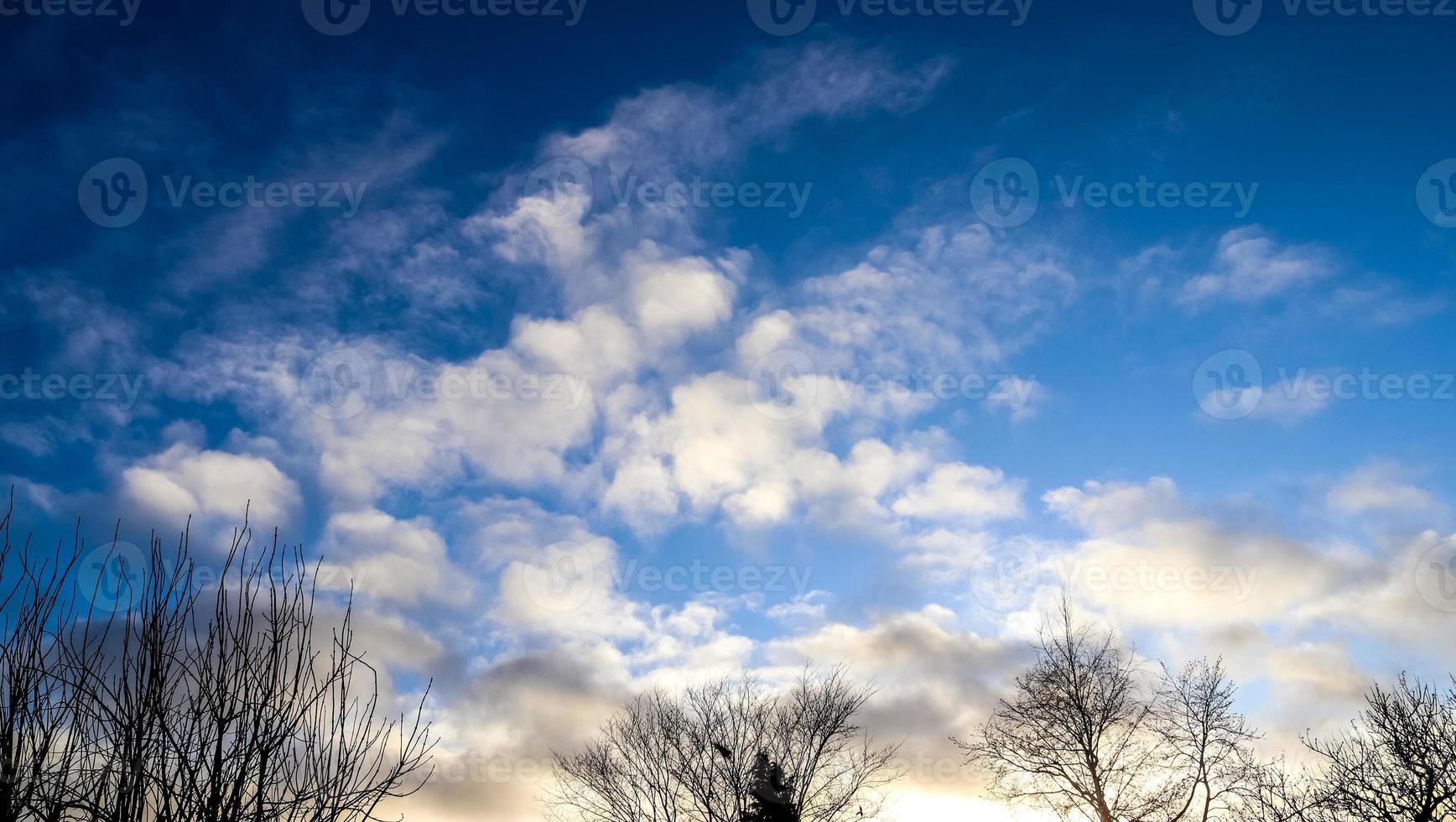 Beautiful panorama of orange and yellow clouds at sunrise photo