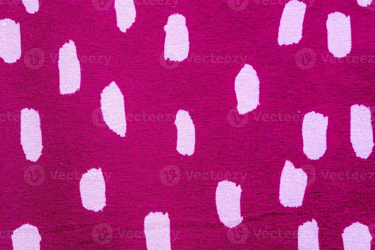 Detailed close up view on samples of cloth and fabrics in different colors found at a fabrics market photo
