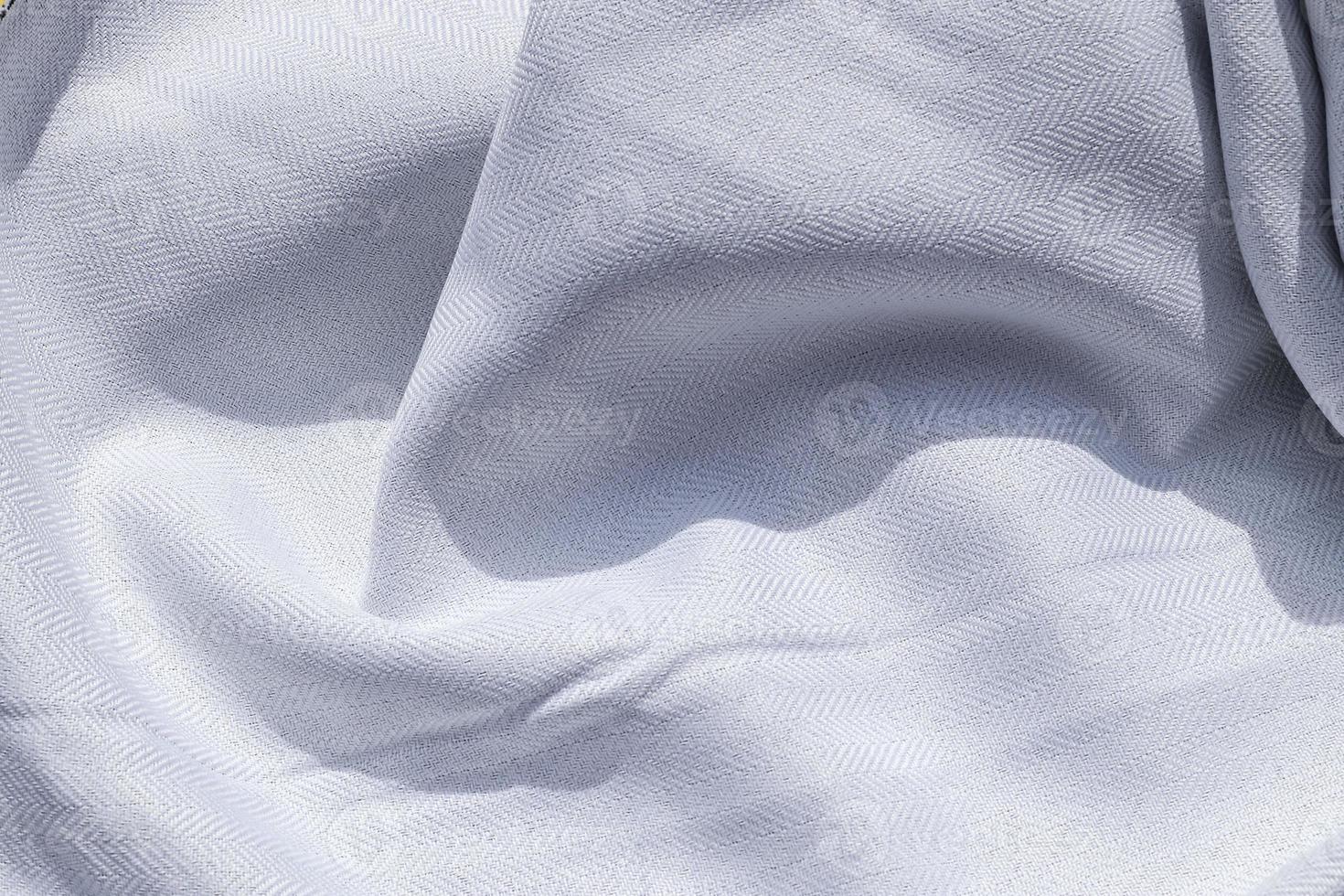 Detailed close up view on samples of cloth and fabrics in different colors found at a fabrics market photo