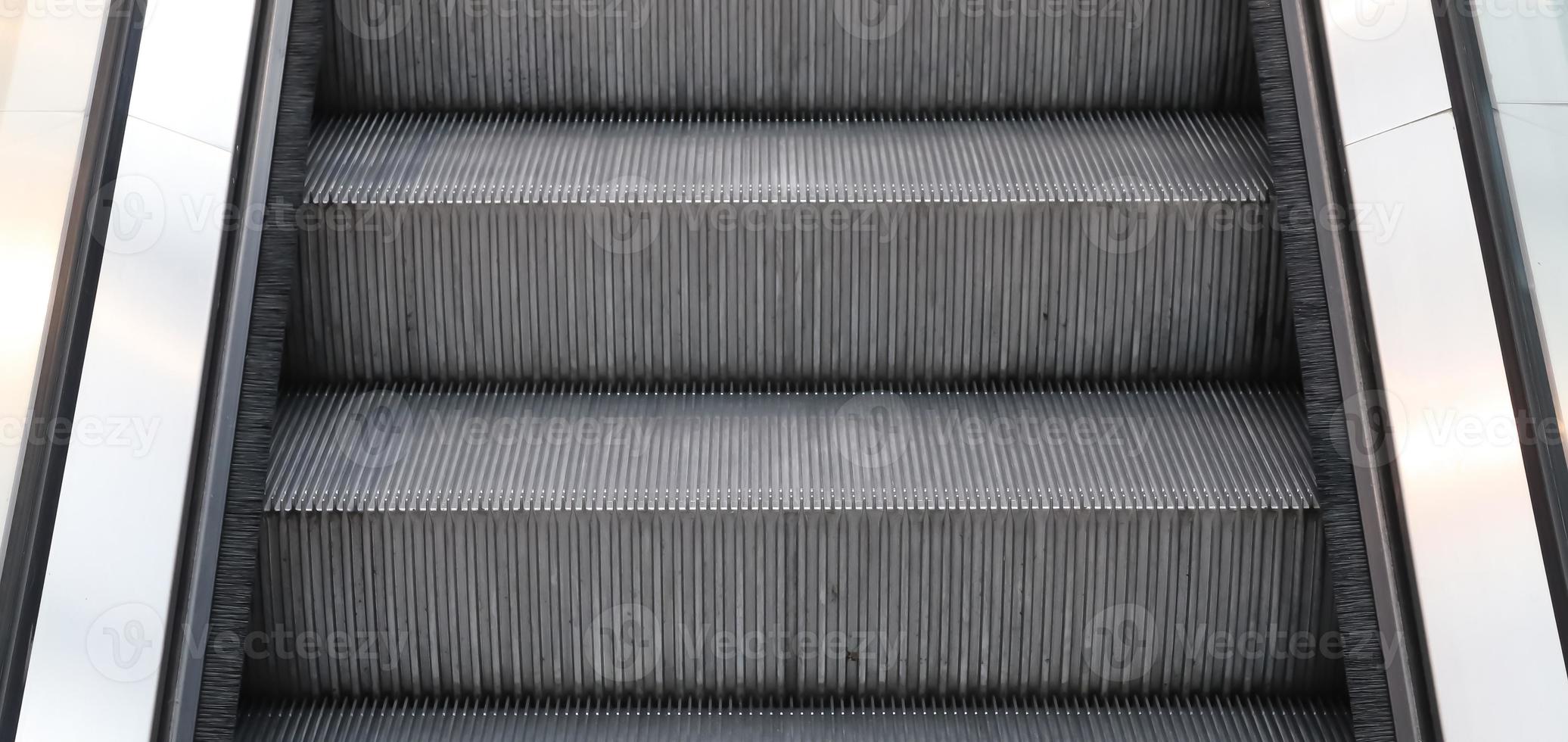 Close up of empty steps of an escalator in a perspective view. photo