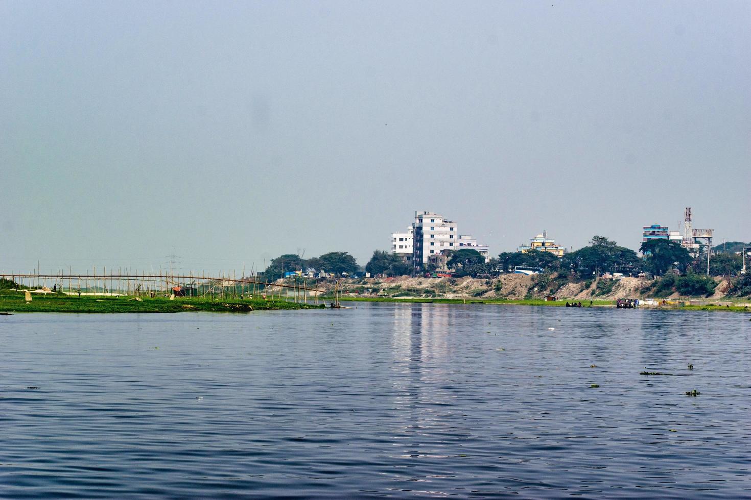 A landscape with river and buildings. photo