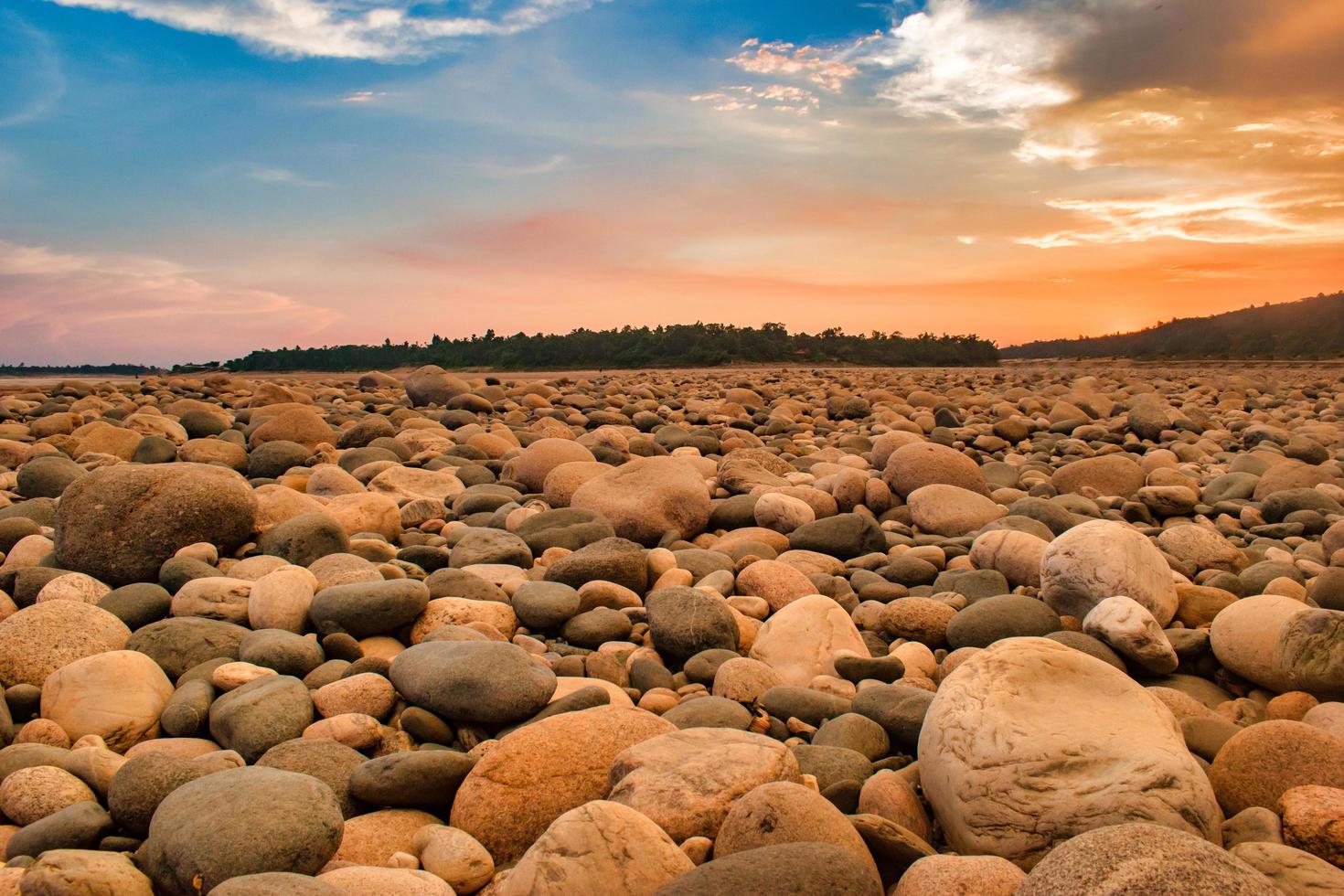 Beautiful riverside stone view in the afternoon with blue sky. Bangladesh Landscape. photo