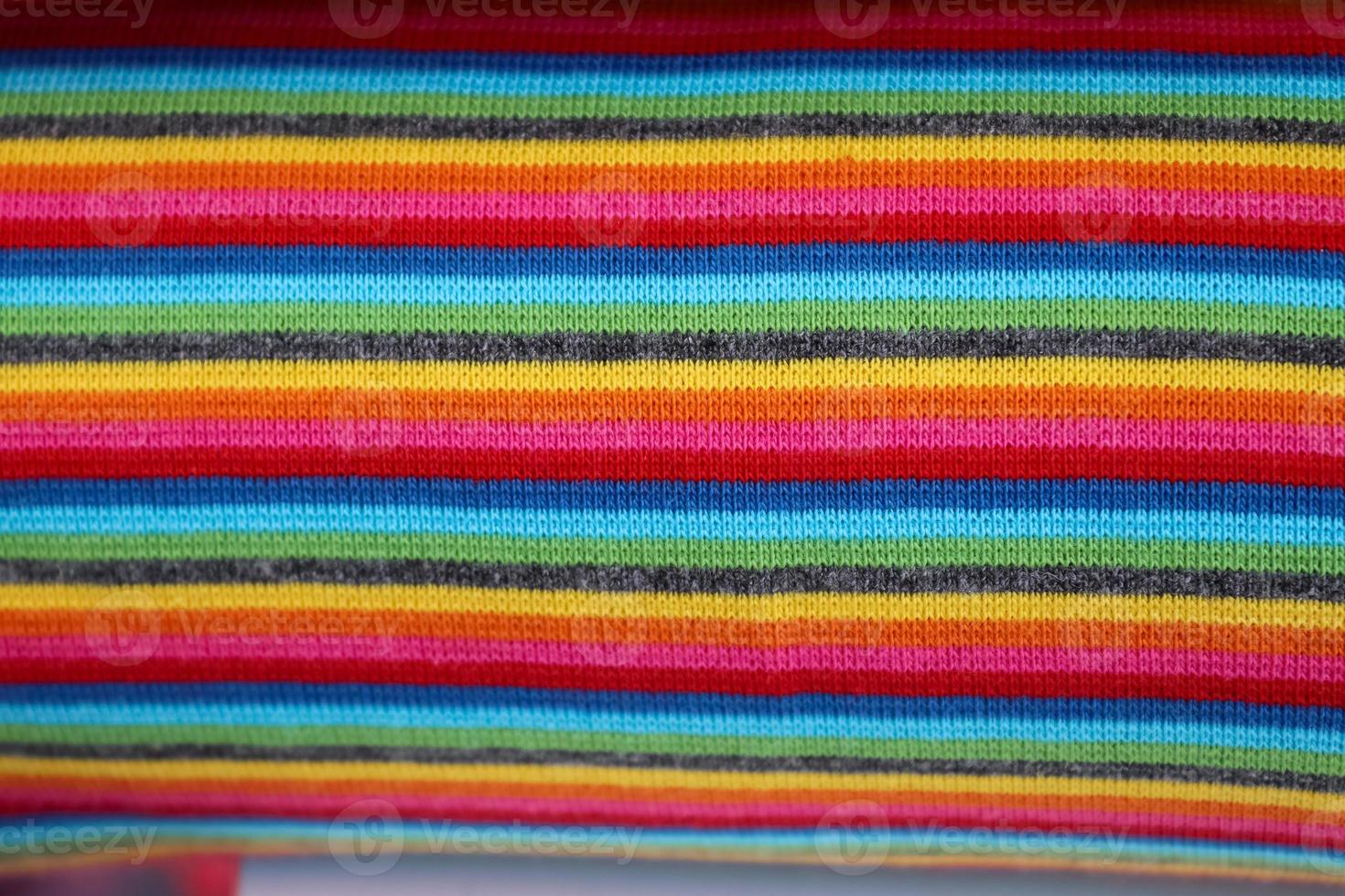 Detailed close up view on samples of cloth and fabrics in different colors found at a fabrics market photo