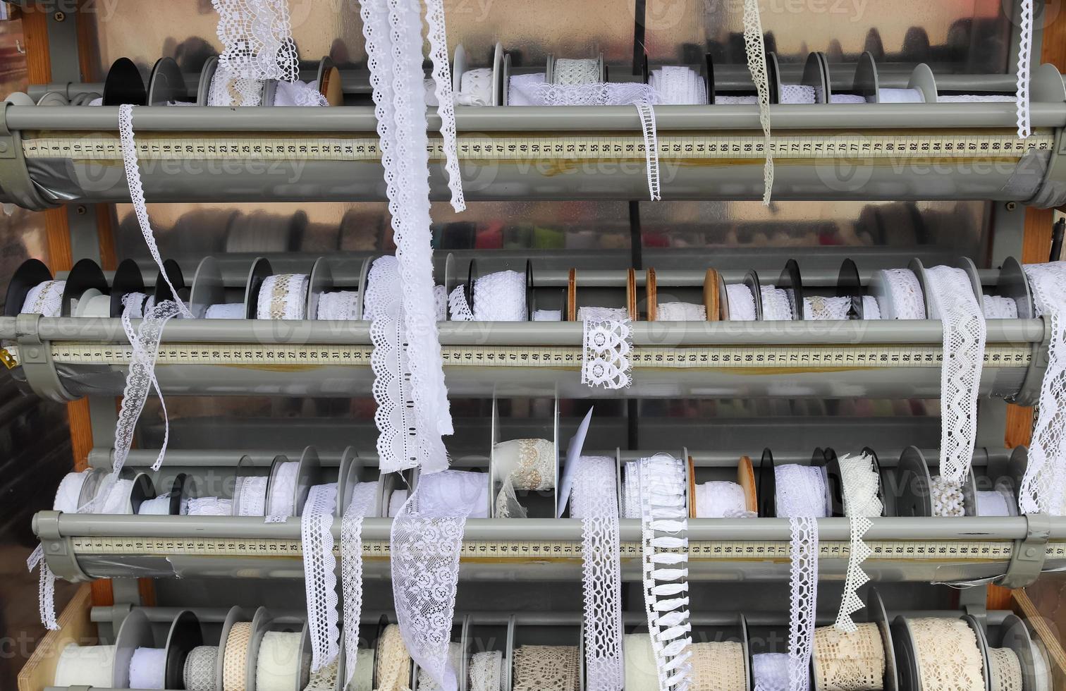 Detailed close up view on samples of cloth and fabrics in different colors found at a fabrics market photo