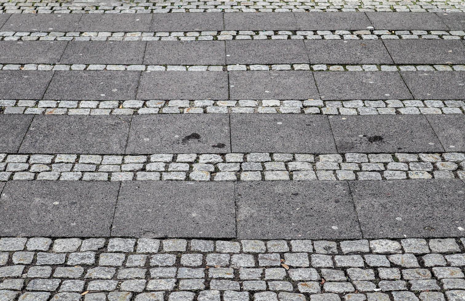 Detailed close up on old historical cobblestone roads and walkways photo