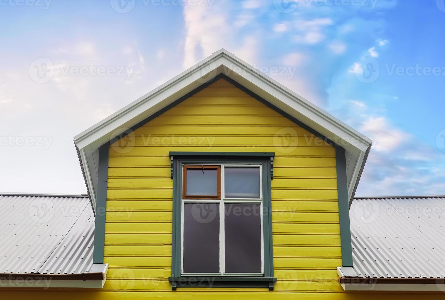 Roof window in velux style with roof tiles - icelandic architecture. photo