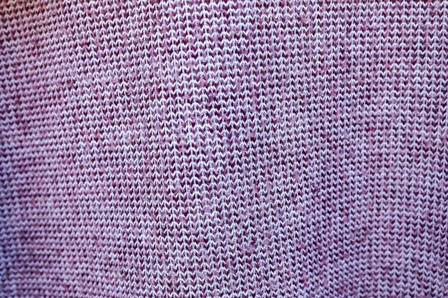 Detailed close up view on samples of cloth and fabrics in different colors found at a fabrics market photo