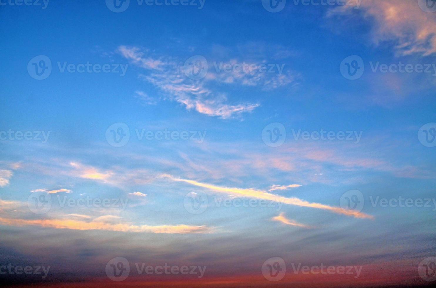 Beautiful panorama of orange and yellow clouds at sunrise photo