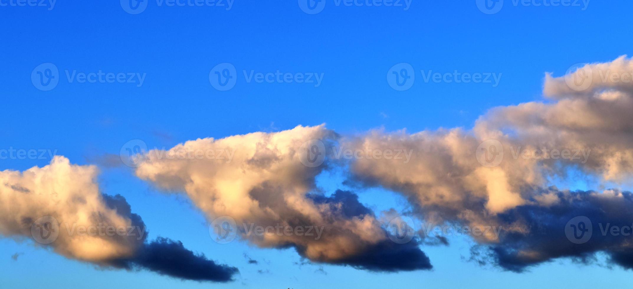 Beautiful panorama of orange and yellow clouds at sunrise photo