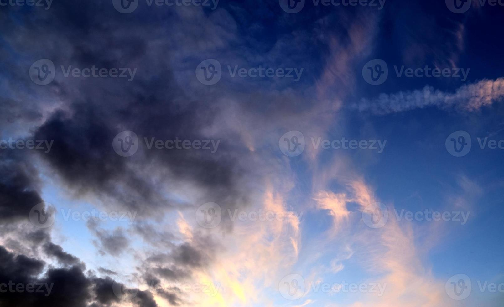 Beautiful panorama of orange and yellow clouds at sunrise photo