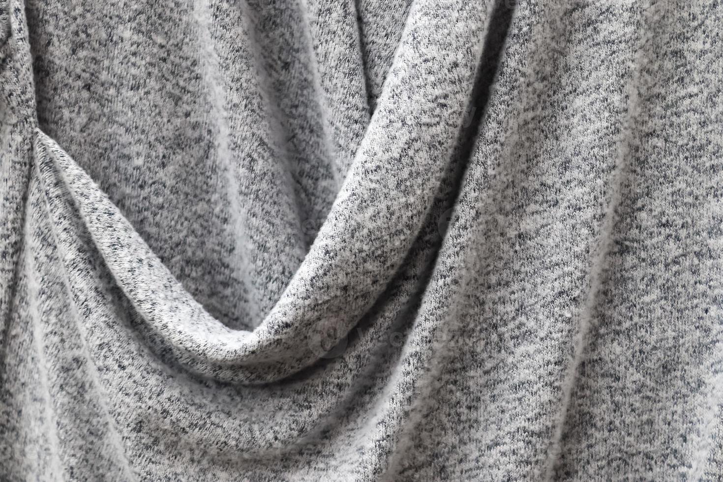 Detailed close up view on samples of cloth and fabrics in different colors found at a fabrics market photo