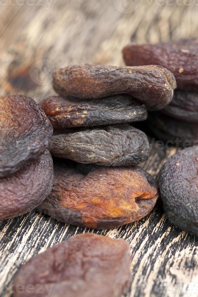 dark dried apricots of large size 9405237 Stock Photo at Vecteezy