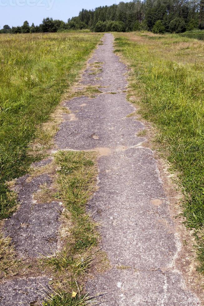 a narrow road for pedestrians and vehicles photo