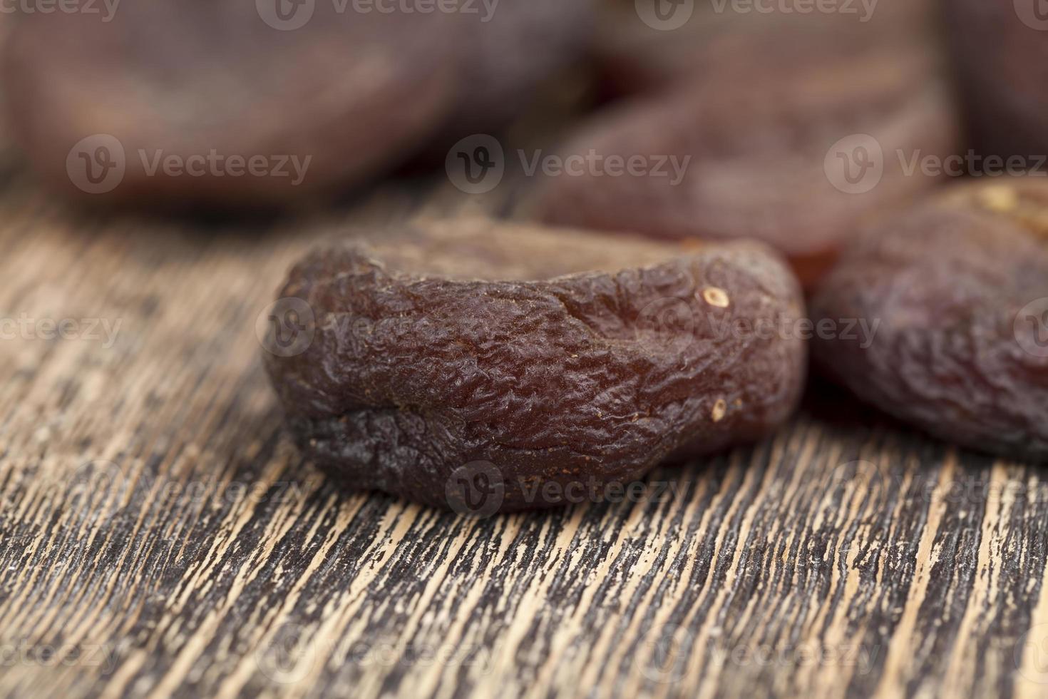 dark dried apricots of large size 9405819 Stock Photo at Vecteezy