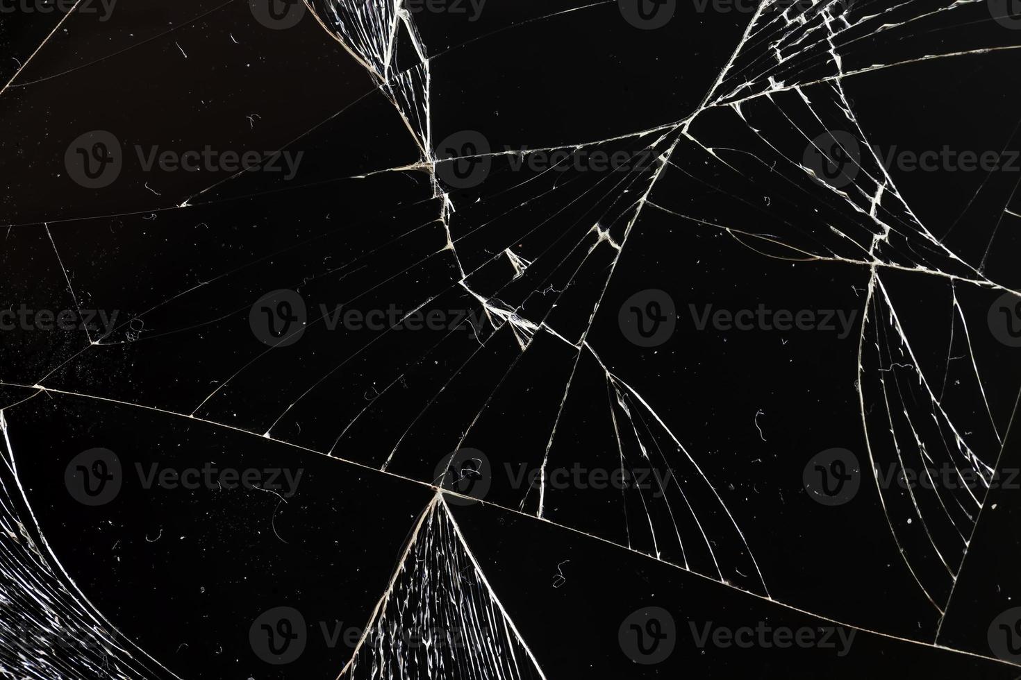 broken thin glass with lots of cracks photo