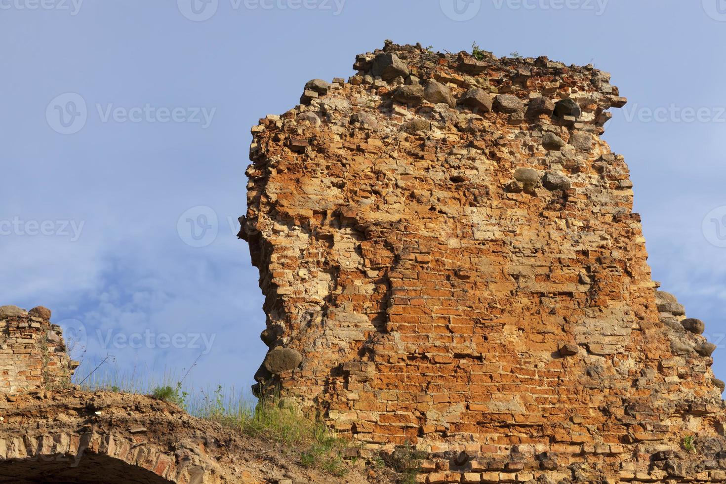 ruins of an ancient red clay brick castle photo